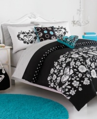 The Roxy Alexis comforter set exudes modern sophistication with an understated floral and polka dot landscape.