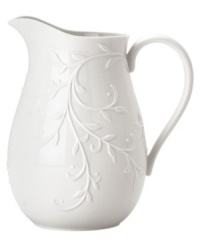 An elegant white-on-white pattern featuring an embossed vine motif and interior glaze lends the Opal Innocence Carved pitcher to refined dining every day.