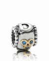 A sweet reminder of Dad, this sterling silver charm features D lettering and 14K gold bezel-set blue zirconia stones.