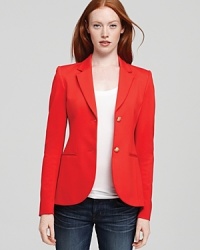 This radiant Theory blazer lends the perfect pop of color with denim in a classic two-button silhouette.