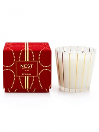 Captures the aroma of a sparkling holiday season. Large, three-wick candle fragranced with inviting notes of pomegranate, mandarin orange, pine, cloves and cinnamon. Housed in an elegant glass vessel and presented in a red velvet box. Created by Laura Slatkin. Approximately 100 hours of burn time. 19.7 oz.