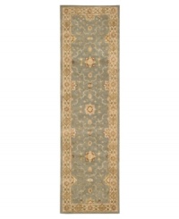 With a soft, aqua-blue center, bordered in light beige, this Nourison area rug offers a fluid color palette style for any space. Rivaling the world's finest heirloom rugs, this handcrafted piece is made with a luxuriously dense New Zealand wool pile and woven with generous portions of pure silk.