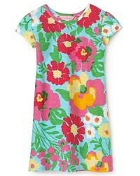 Overlapping flowers in oversaturated hues evoke a retro sensibility in Lilly Pulitzer's Little Kelsea dress.