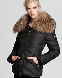 An oversized fur collar lends luxurious style to this plush down jacket from Dawn Levy.