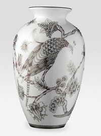 Like a beautiful Japanese screen translated to fine bone china, this graceful, urn-shaped vase presents a meticulously rendered peacock surrounded by lush flowers in soft shades of plum and platinum, embellished with hand-set amethyst-tinted Swarovski crystals.Bone chinaCrystals17H X 10W X 7.5DHand washImported