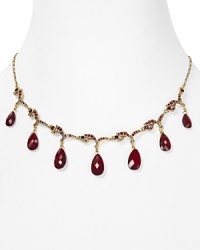 Richly colored glass stones punctuate a delicate Carolee necklace, crafted from 14-karat gold plate.