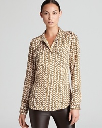 A subtle chain-link print lends luxe inspiration to a MICHAEL Michael Kors shirt for a glamorous 9-to-5 option.