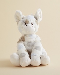 An adorable giraffe doll is adorned with playful dots.