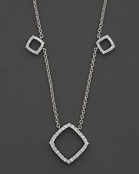 Diamonds encrust 14K white gold stations in elegant geometric shapes.