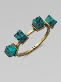 An architectural piece with four turquoise cube stones on a hinged bangle. TurquoiseBrassDiameter, about 2½Hinged closureMade in USA