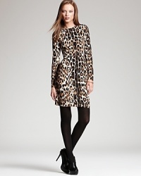 Exotics go executive as chic cheetah print enlivens an essential Karen Kane dress. Sheer tights and sleek booties take the style from feline to fierce.