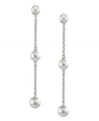 Elongated grace. Cultured freshwater pearls (4-8 mm) are arranged across a sterling silver chain to create a sophisticated set of long drop earrings. Approximate drop: 2 inches.