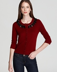 Stunning beaded embellishment shines from a classically styled kate spade new york cardigan for effortless elegance.