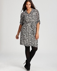 Bustling with a lively zebra print, this Calvin Klein Plus dress sends your 9-to-5 style on a wild safari ride. Polish off the look with sleek black heels for a roaring fashion statement.