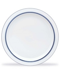 White porcelain dinner plates designed by Dansk master-craftsman Niels Refsgaard, with a style based on the relaxed atmosphere of a welcoming country inn.