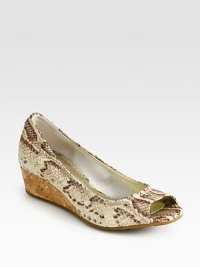 Divine snake print adds dimension to this leather wedge with high-tech cushioning and a natural cork wedge. Cork wedge, 1 (25mm)Snake-print leather upperLeather liningRubber solePadded insoleImported