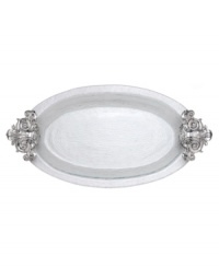 Hold court with the regal elegance of Fleur de Lis serveware. Ornate handles featuring the iconic French lily evoke another era, gleaming spectacularly on this magnificent glass platter from Arthur Court.