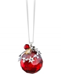 All-around brilliant. The Light Siam Satin ball ornament sparkles in faceted Swarovski crystal with elaborate silvertone accents. Delicate, dangling charms – including a real metal bell – add extra dazzle.