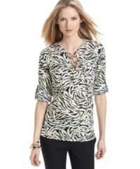 MICHAEL Michael Kors' sophisticated animal print is just the thing to pair with the season's colorful, skinny pants. Flap pockets at the chest and a drawstring neckline give an air of utility-chic. (Clearance)