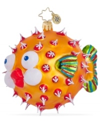 Bursting with holiday joy, the Puff a Kiss ornament from Christopher Radko is dotted with red and white and puckering up under the mistletoe in handcrafted glass.