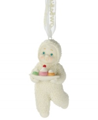 This precious Snowbaby with piercing blue eyes and rosy cheeks likes to indulge as much as you do as she carries a tray with a trio of sweet treats. Crafted of pure porcelain bisque from Department 56, this ornament is perfect for the dessert-lover.