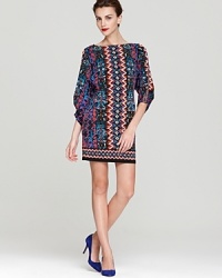 This Laundry by Shelli Segal jersey dress lends a bold look in a vibrant, multicolor print.