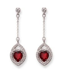 Timeless and romantic, Swarovski's silver tone mixed metal pierced earrings add feminine elegance to any outfit. The Siam crystal hearts and clear crystal pavé sparkle in classic, festive colors. Approximate drop: 1-7/8 inches.