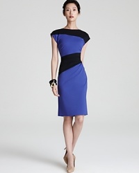 Asymmetrical color-blocking lends figure-flattering style to this ruched Escada jersey dress.