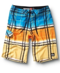 Off the grid. He'll hit the waves with uncharted style in these plaid board shorts from Quiksilver.