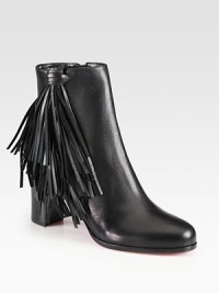 Channel 70's-era vibes wearing this leather ankle boot with playful fringe and a convenient side zip. Stacked heel, 2¾ (70mm)Leather upperSide zipLeather liningSignature red leather solePadded insoleMade in Italy