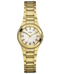 Golden glam, by GUESS. A ladylike silhouette adds fashion to this chic sport watch.