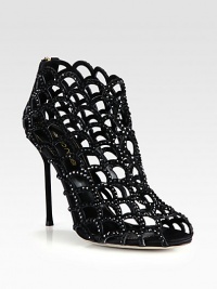 A suede heel lifts this modern cage silhouette of fine satin coated in light-catching Swarovski crystals. Suede-covered heel, 4¼ (110mm)Satin upper with Swarovski crystalsPeep toeBack zipLeather lining and solePadded insoleMade in Italy