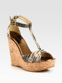 A natural cork wedge and platform is the foundation of this snake-embossed leather silhouette, topped with metallic leather accents. Cork wedge, 4¾ (120mm)Cork platform, 1¼ (30mm)Compares to a 3½ heel (90mm)Snake-embossed leather upper with metallic leather trimAdjustable ankle strapLeather liningRubber solePadded insoleMade in SpainOUR FIT MODEL RECOMMENDS ordering true size. 