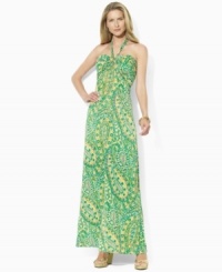 A vibrant sweeping pattern enlivens a breezy petite maxi dress, rendered in sleek jersey with a halter neckline, from Lauren by Ralph Lauren.