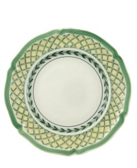 Bring the lush bounty of the French countryside to your table with this vibrant mix-and-match dinnerware and dishes collection from Villeroy & Boch. This scalloped bread and butter plate is available in four complementary patterns. The Fleurence pattern has a pale yellow center encircled with a garland of summer fruits. The Valence pattern has a yellow rim that surrounds a painted bunch of cherries in the center. The Orange pattern features a green and yellow trellis on the rim while the Vienne pattern is white with a yellow rim that's framed by green edging and the recurring leaf garland.