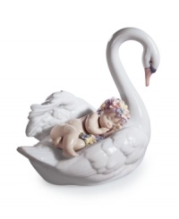 Mama swan takes a sleepy baby on the ride of her life in the fanciful Drifting Through Dreamland figurine, handcrafted in Lladro porcelain.