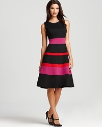 A swing skirt lends a ladylike look to this belted Anne Klein dress, detailed with punchy bands of colorful stripes.