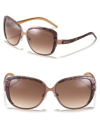 Up the style ante in round cat eye sunglasses with snake printed sides and gradient lenses.