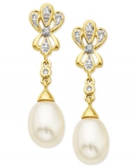 Go for the glamour. These drop earrings, crafted from 10k gold, dazzle with cultured freshwater pearls (7-9 mm) and diamond accents lending a shining touch. Approximate drop: 1-1/8 inch.