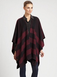 Signature check pattern is printed on sumptuous cashmere in a cape silhouette.Cashmere66 X 47Open frontDry cleanImported