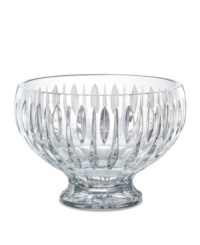 A series of vertical wedge cuts around the side of this lead crystal bowl create an effect of subtle radiance. Measuring 10 in diameter with a dramatic raised base.