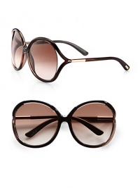 Oversized round sunglasses feature Tom Ford Signature tubular temples and floating lens with logo detail. Available in brown shimmer with gradient brown lens or black with grey lens.Signature tubular temples100% UV protectionMade in Italy