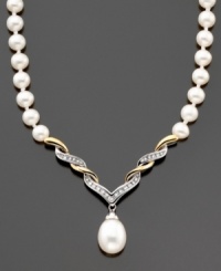 A pièce de résistance; this stunning necklace features cultured freshwater pearls (8-10 mm) and round-cut diamonds (1/10 ct. t.w) set in 14k gold and sterling silver. Approximate length: 17 inches. Approximate drop: 1-1/2 inches.