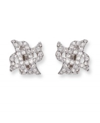 Dainty X-shaped clip on earrings flaunt clear Swarovski crystals in a pavé setting. These silver tone mixed metal earrings bridge the gap between classic and trendy. Approximate diameter: 5/8 inch.