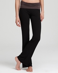 Tried-and-true Calvin Klein comfort meets sporty styling in these stretchy lounge pants with a foldover waistband.