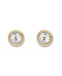 Pretty as a picture! Swarovski's framed crystal stud earrings are equally chic for a day at the office or a night on the town. Made in gold tone mixed metal. Approximate diameter: 1/2 inch.