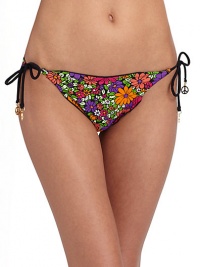 Cheery floral graphics teamed with ruffle edges, make a fun and flirty string bottom.Elastic waistband Side ties with peace charms Ruffle edges Fully lined 82% nylon/18% spandex Fully lined Hand wash Made in USA of imported fabricPlease note: Bikini bottom sold separately. 