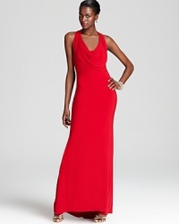 Stunning in a fiery scarlet hue, ABS by Allen Schwartz's cowl neck gown lends a look of modern luxury.