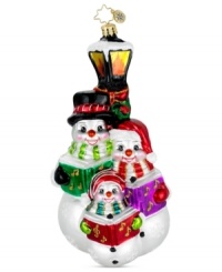 A family of caroling snowmen hits all the season's high notes in exquisite, handcrafted glass. Glitter snowflakes, music books and bright, shiny color give the ornament that classic Christopher Radko feel.