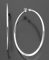 Take your look the extra mile with these trendy skinny silvertone mixed metal hoop earrings by Betsey Johnson. Approximate diameter: 2 inches. Approximate drop: 1 inch.